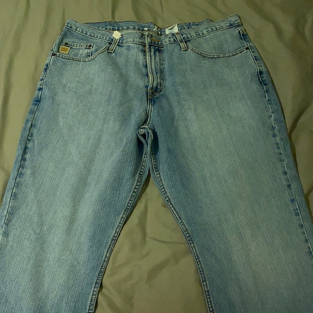 Little wear and tear in the pockets and around the end of the pant legs
